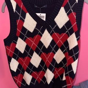 Sweater vest with red hearts